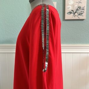 Gorgeous red top with silver detail and open arms